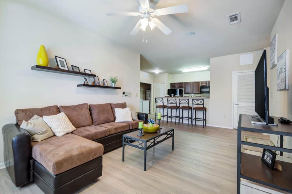 high view off campus apartments near utsa san antonio fully furnished 1 2 and 4 bedroom apartments common area living room and kitchen upgraded wood style flooring